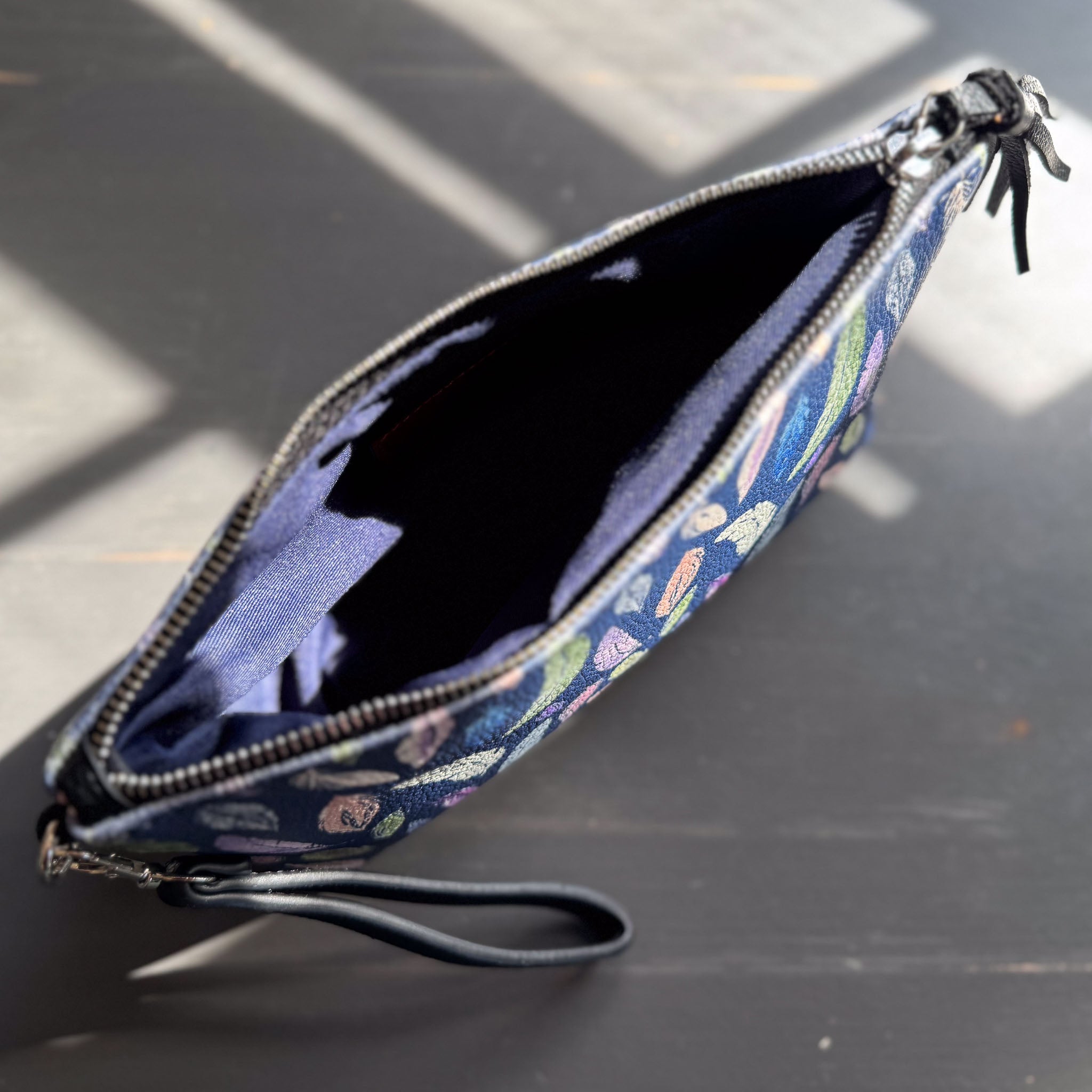 the featherlight clutch collection in vegan leather