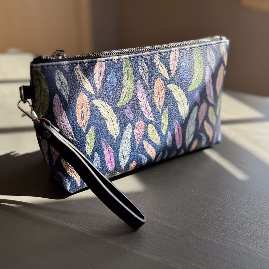 the featherlight clutch collection in vegan leather