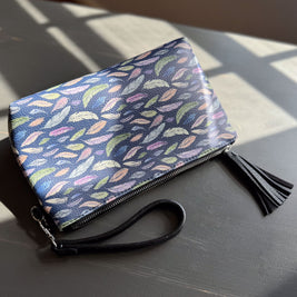the featherlight clutch collection in vegan leather